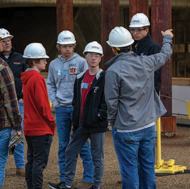 students taking a tour at the cardinal plant