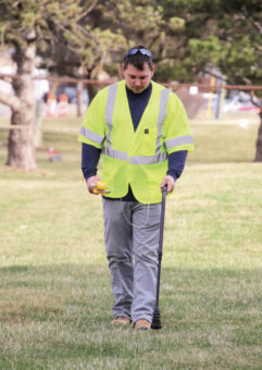 A worker looking for a gas leaking spot